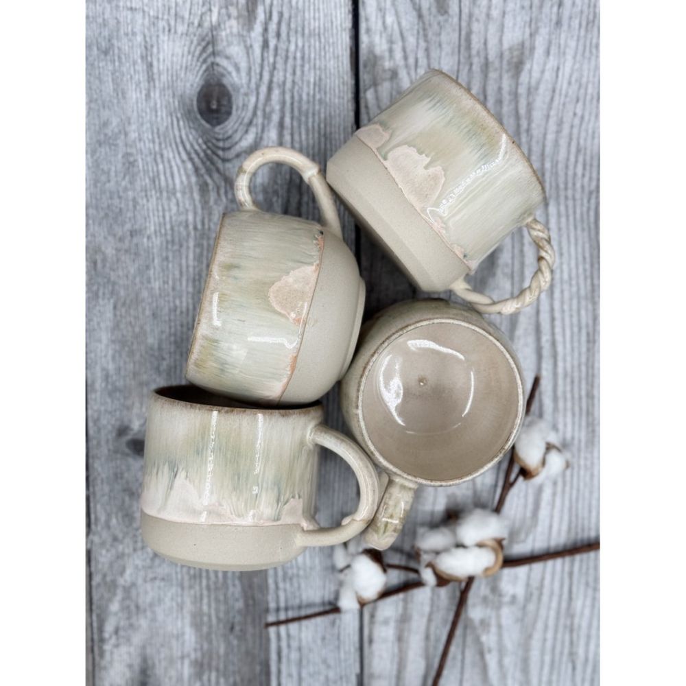 Handmade ceramic mugs with handles